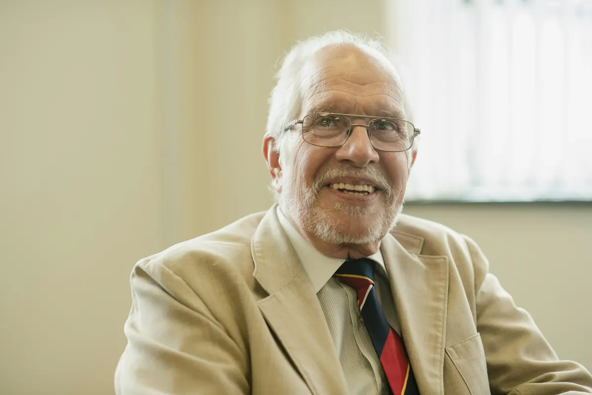 Smiling older man in a blazer
