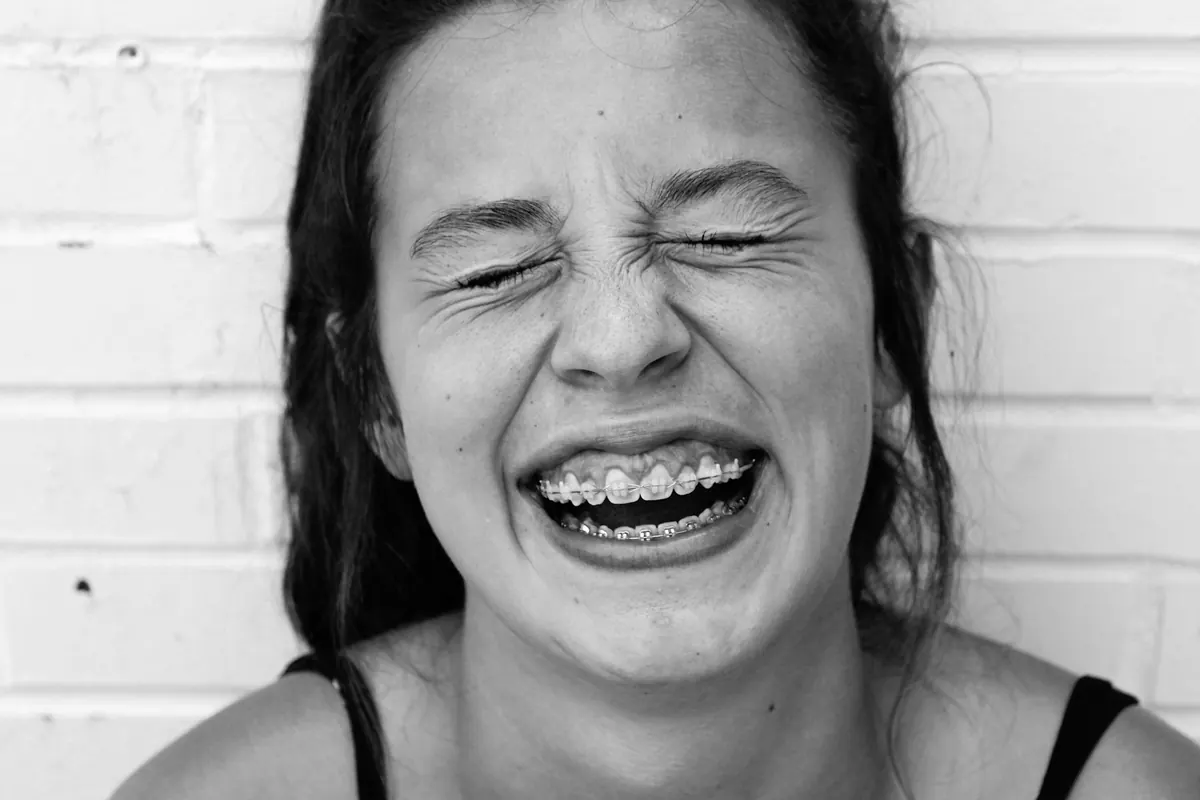 Woman with braces laughing