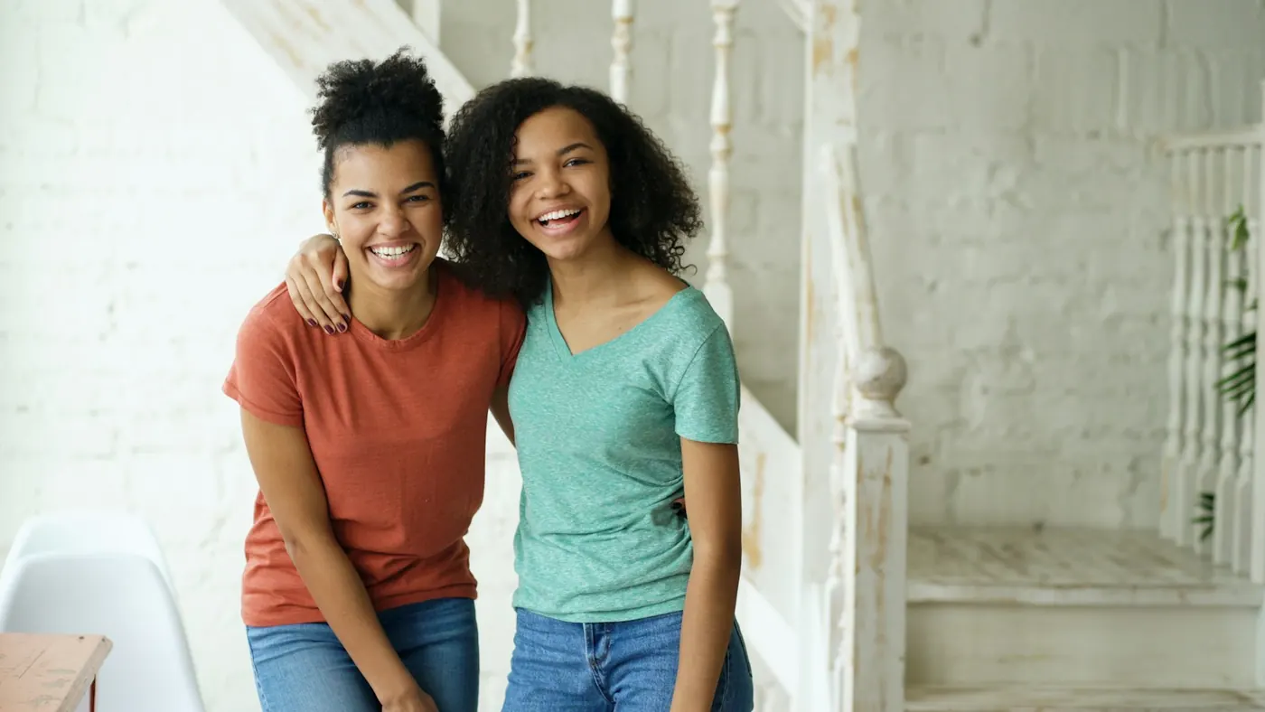 Two smiling teenage friends